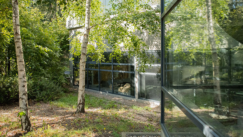 Exterior facade of Stellantis Design studio surrounded in nature