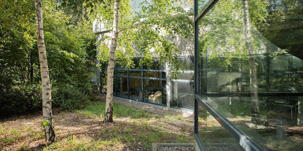 Exterior facade of Stellantis Design studio surrounded in nature